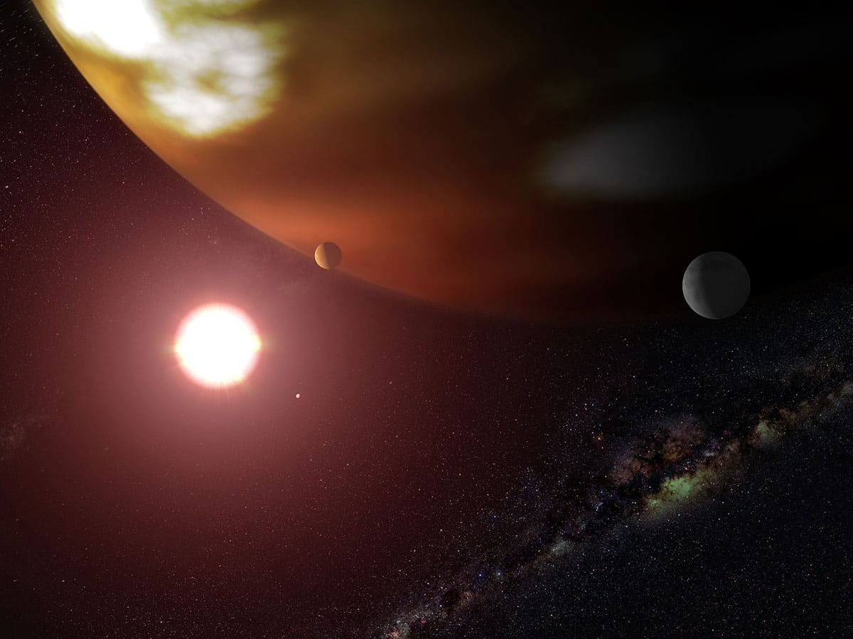 Künstlerische Darstellung eines extrasolaren Planetensystems mit Monden (Illu.).Copyright: NASA/ESA u. G. Bacon (STScI)