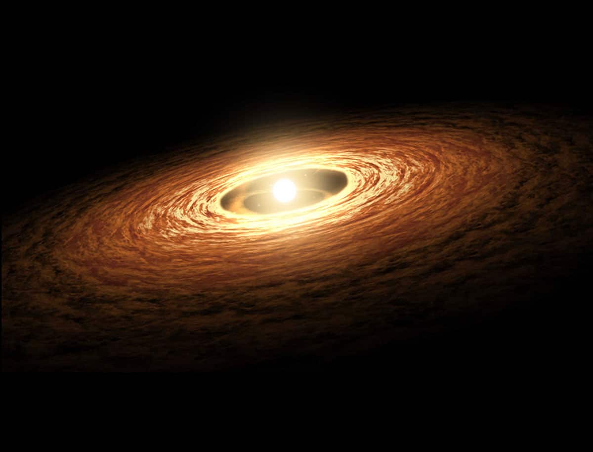 Grafische Darstellung eines jungen Sterns, der von einer Scheibe aus Gas und Staub umgeben wird. Aus diesem Material können neue Planeten entstehen. Ob diese die chemischen Voraussetzungen für erdähnliches Leben besitzen, hängt vom richtigen Sauerstoffgehalt während der Kernbildung ab (Illu.).Copyright: NASA/JPL